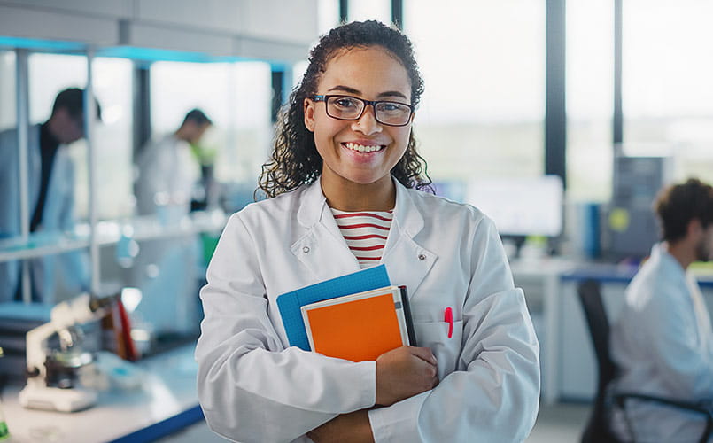 A young black scientist working in a medical laboratory setting