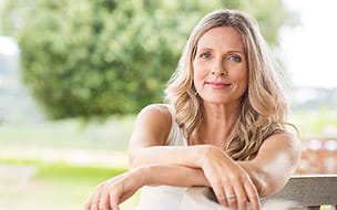 Close up of a mature blonde woman smiling