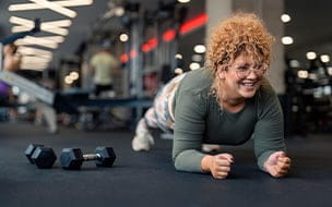 Young woman with weights