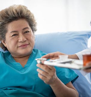 Getty image depicting inpatient care of patient receiving medicine