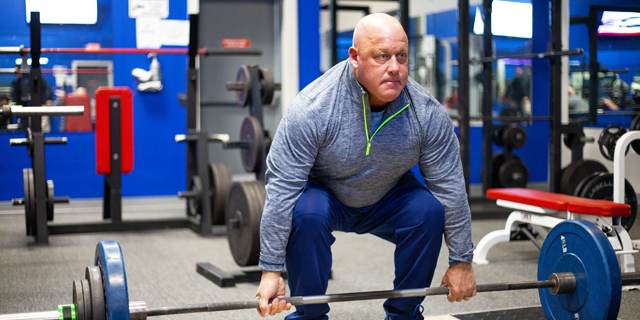 With the strength he called on at powerlifting competitions, UH patient Jeff Peshek is determined to win his war on cancer