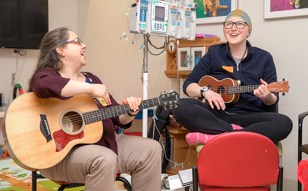 Music therapy with a UH Rainbow Child Life Specialist