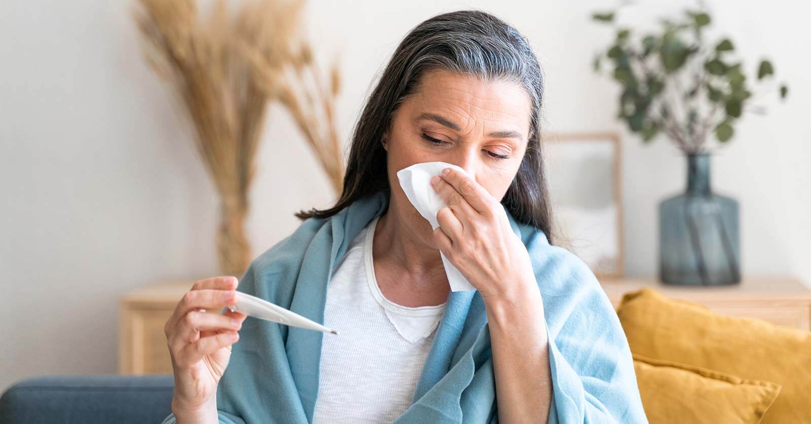 woman taking her temperature