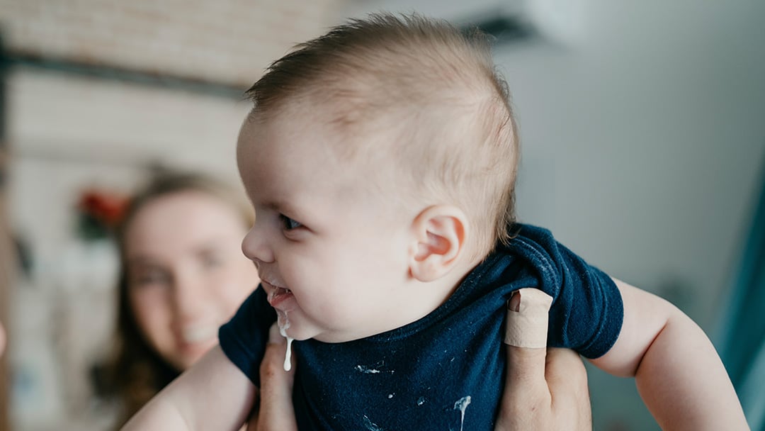 My shops baby spits up breast milk more than formula