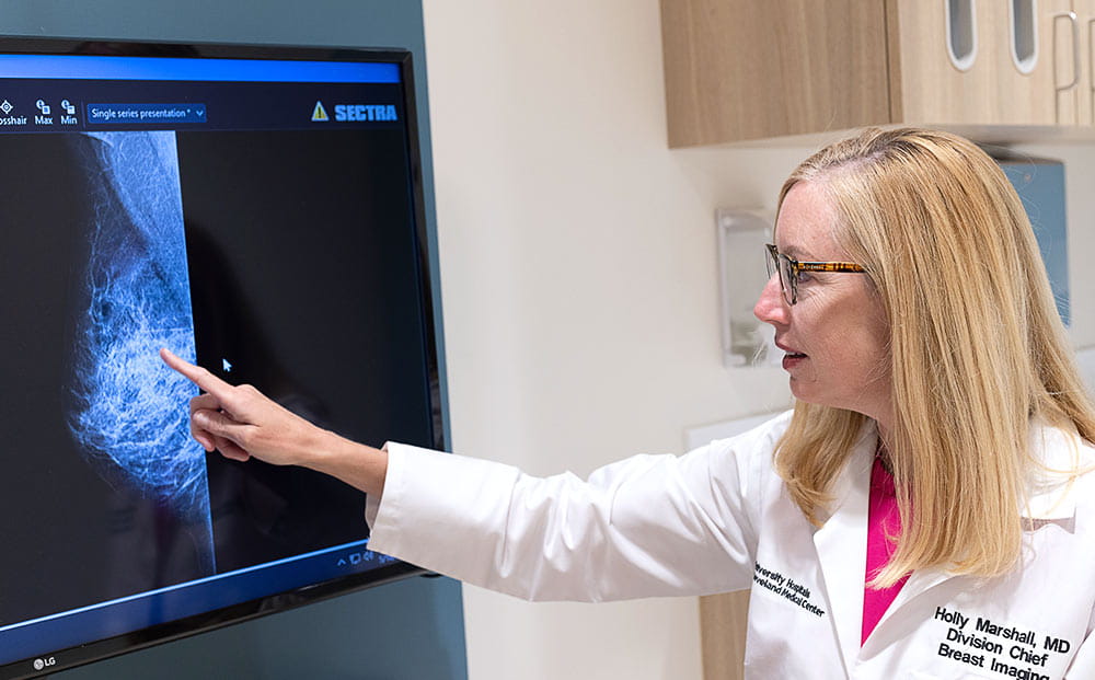Holly Marshall, MD examines a breast x-ray at UH Ahuja Medical Center