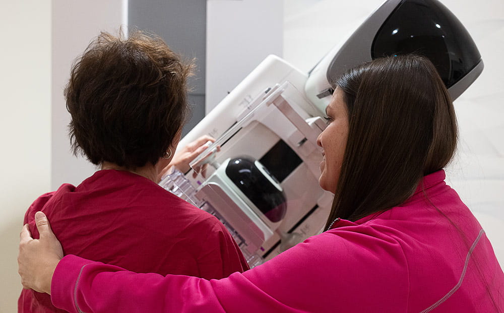 A mammogram technician assists a patient at UH Ahuja Medical Center