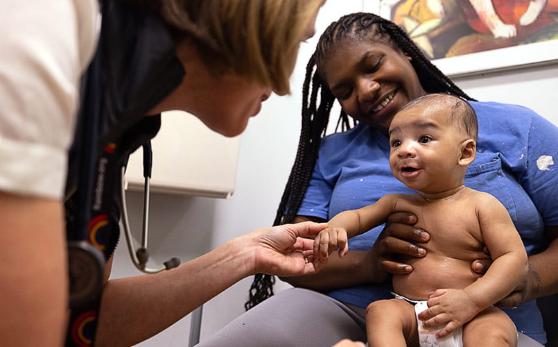 Eva Johnson, MD treats an infant patient at UH Rainbow Ahuja Center for Women and Children