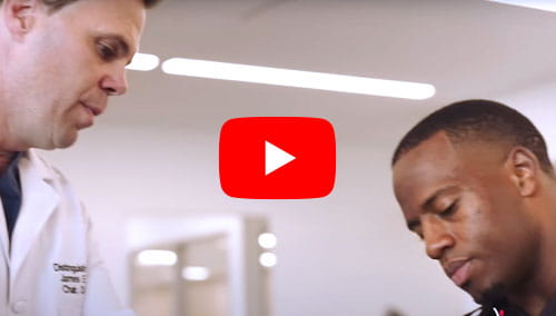 Cleveland Browns legend Nick Chubb being treated by James Voos, MD